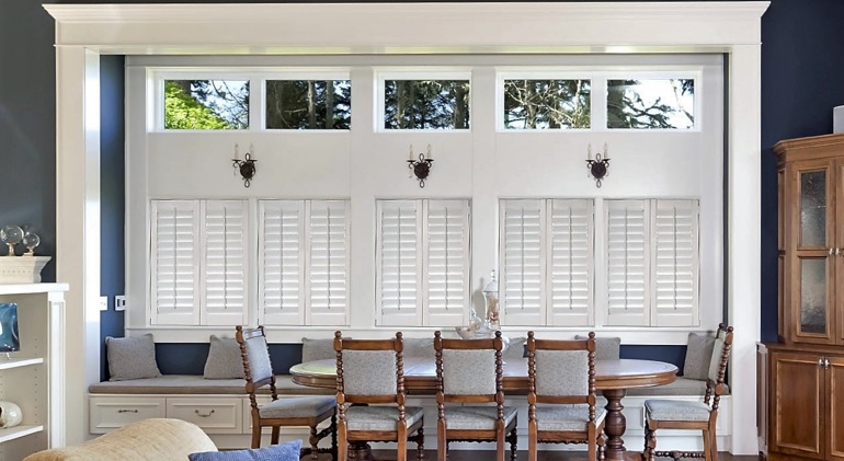 Dallas great room with shut plantation shutters.